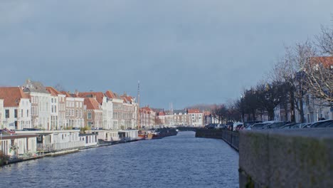 dutch european street view in netherlands with houses, water, canal and traditional classic architecture design with cinematic look