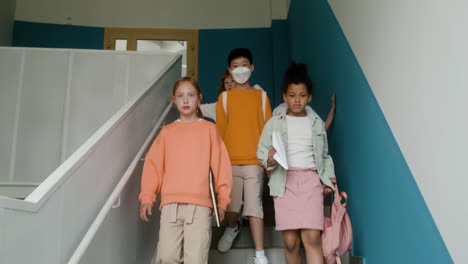 pupils walking down stairs.