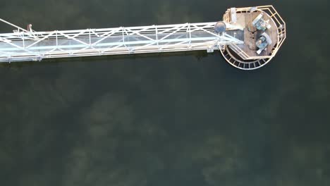 aerial top down close up view of the clarifier with the sludge visible, drone, 4k