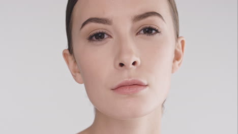 Beauty-portrait-of-woman-with-beautiful-face-tilting-head-up-slow-motion-skincare-concept-on-a-grey-background-slow-motion-Red-Epic-Dragon