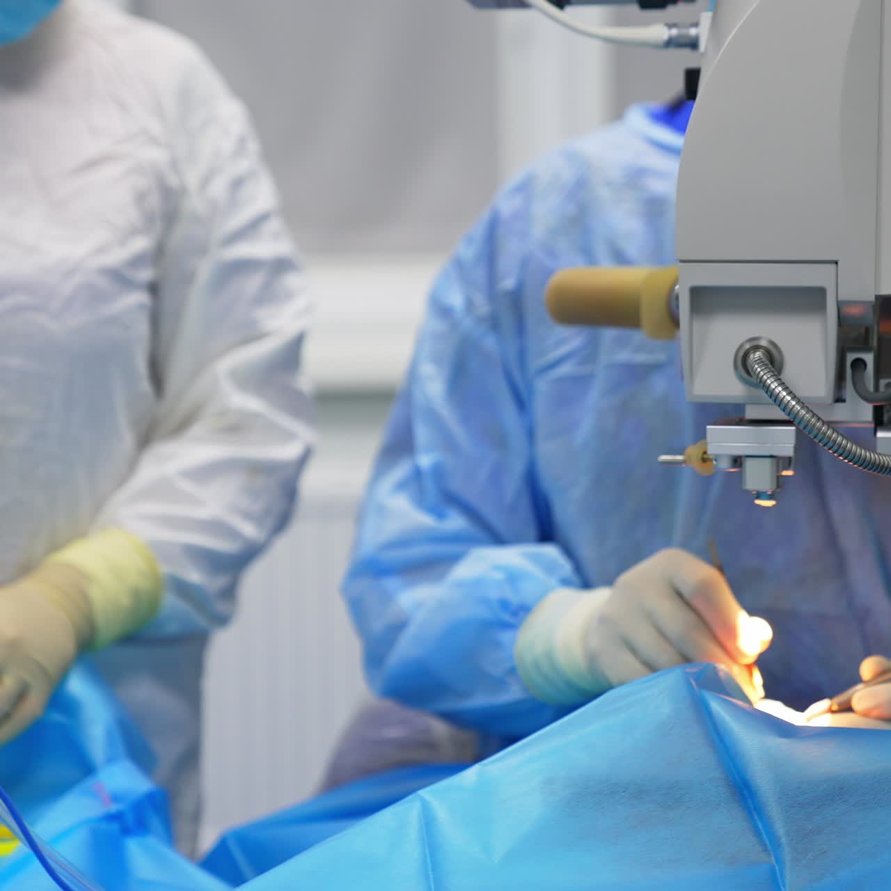 High precise operation on eye. Circle movement around the surgery locality. Blurred backdrop