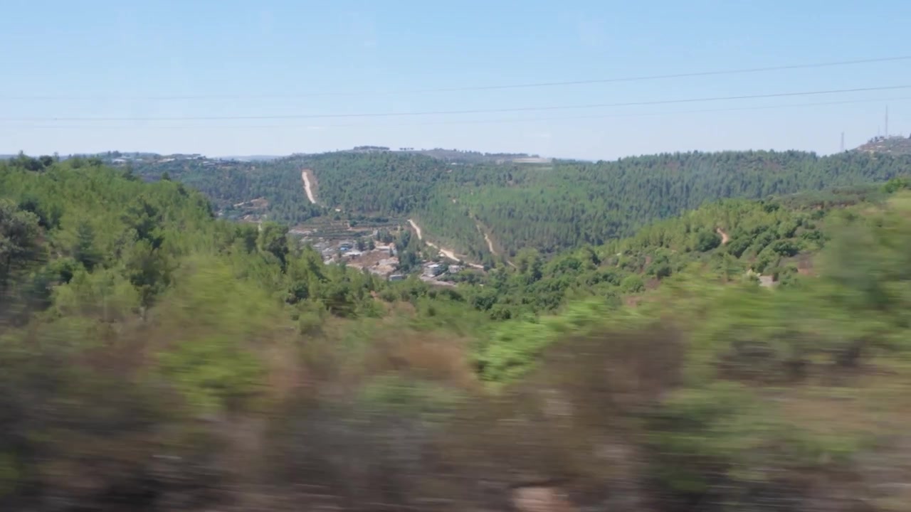 Scenic view of jerusalem hills from moving train