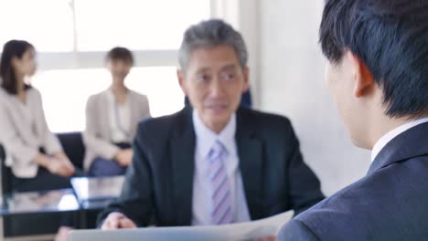 business persons working in an office