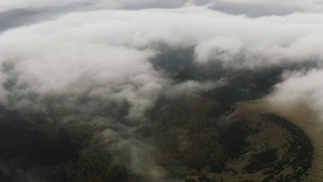 Aerial-View,-Flying-over-autumn-forest-mountains-with-beautiful-clouds,-Slovakia