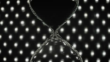 an hourglass with pouring sand