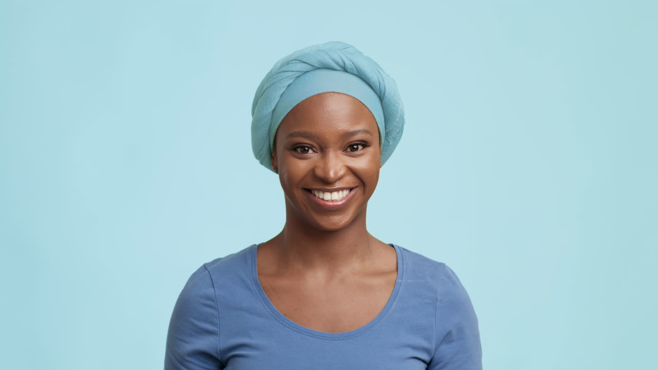 Happy African Woman in a Blue Head Wrap
