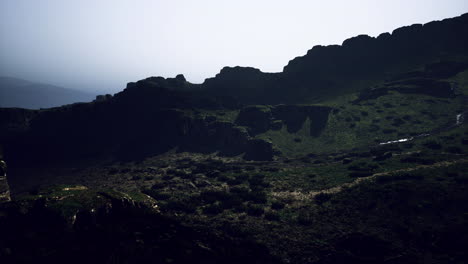 moody landscape at dusk with rugged hills and soft light