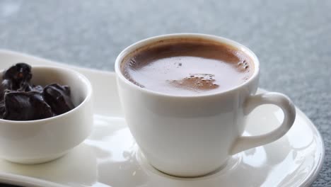 a cup of turkish coffee on table outdoor ,