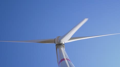 SLOWMO---Detail-of-rotating-wind-mill-turbine---from-bottom