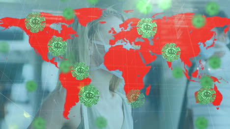 animación de células de covid 19 sobre el mapa del mundo y mujer con máscara facial