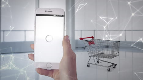 animación de una mano sosteniendo un teléfono inteligente y haciendo compras en línea