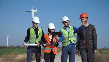 wind turbine engineers reviewing data