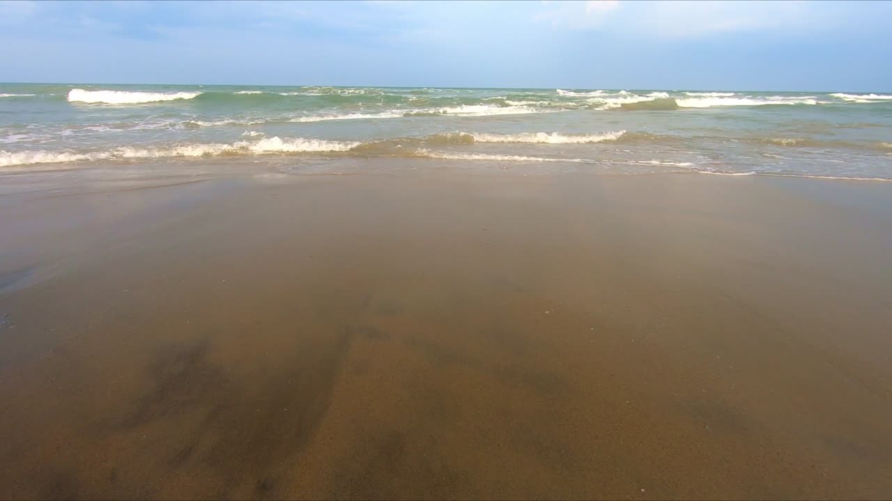 Watching movement of waves on calm afternoon. Static