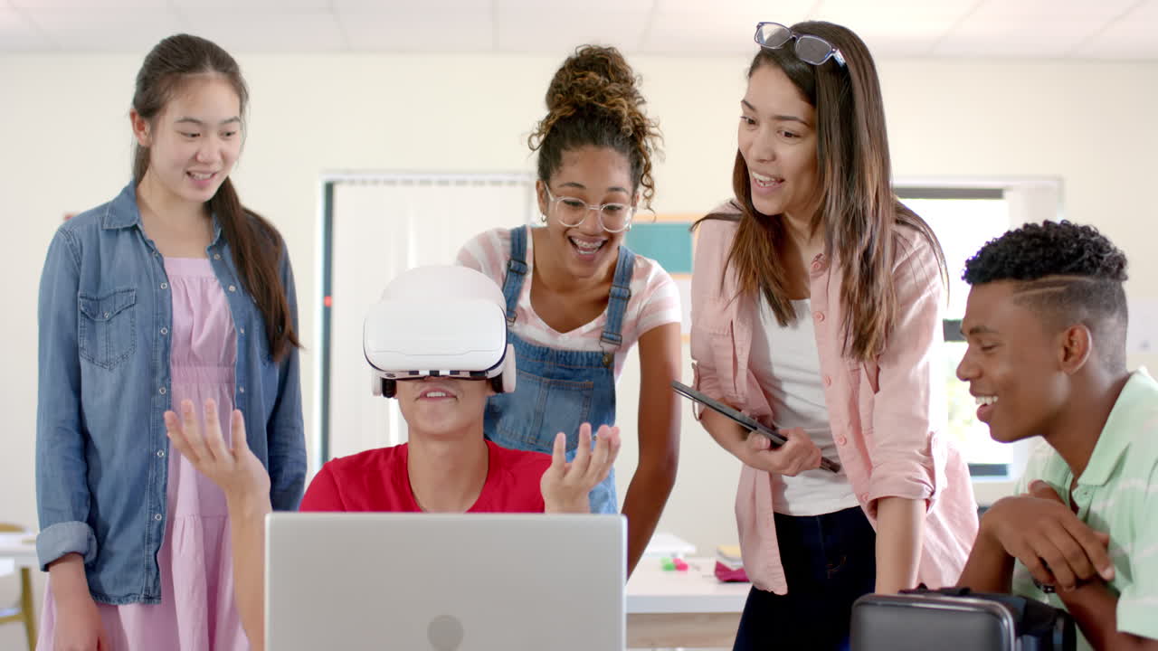 Diverse group of teenagers in high school explores virtual reality, with one wearing a VR headset