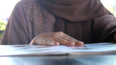 woman reading a menu