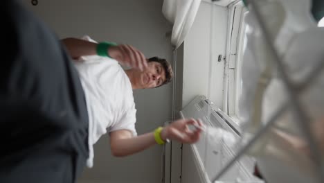 person in a room drying clothes