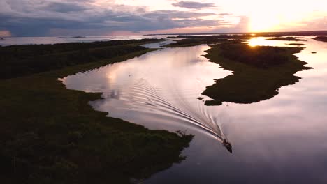 beautiful aerial view of boat at sunset in the parana river