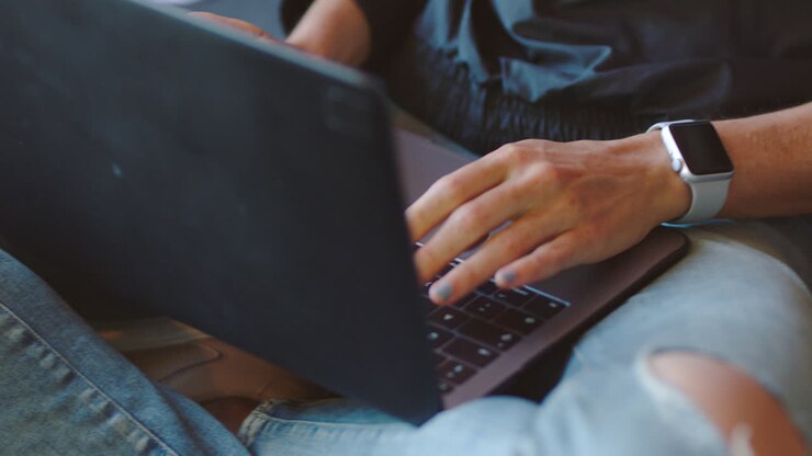 Woman working on a laptop at home
