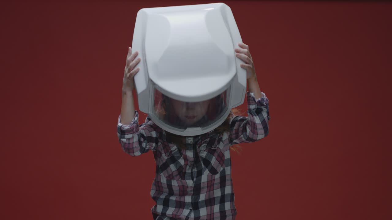 Child Wearing an Astronaut Helmet