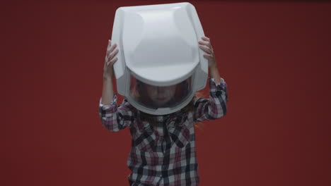 child wearing an astronaut helmet