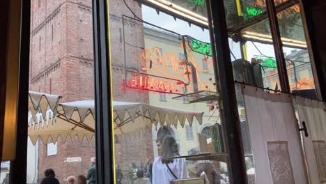 View-from-indoor-to-the-entrance-through-the-window-of-Caffè-Al-Bicerin-in-Turin