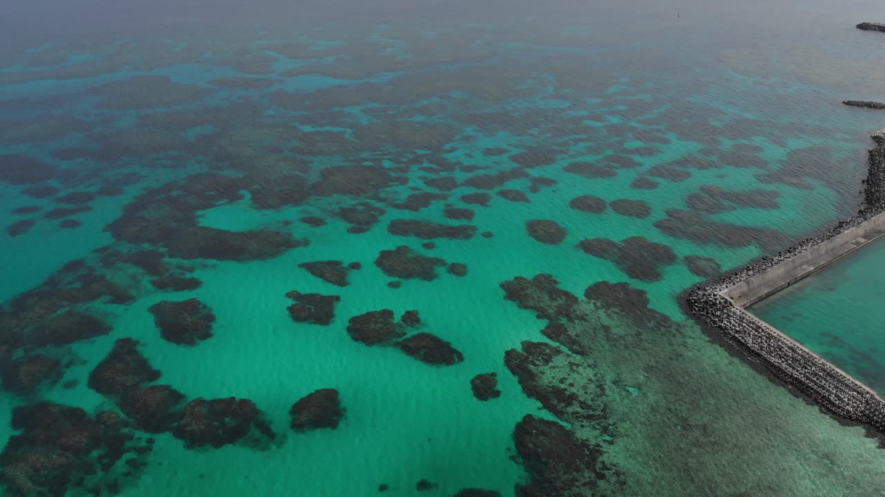 Aerial Scenic Flight Above Iriomote Island Shoreline and Coral Rich Sea, Japan