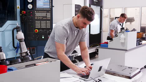 Male Engineer Using CAD Programming Software On Laptop