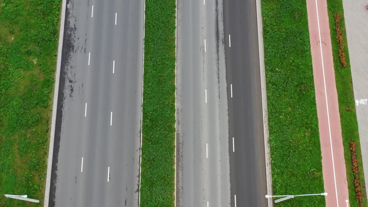 Aerial Top-Down View of Empty Divided Highway with Green Median