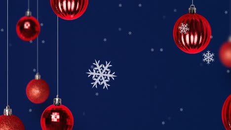 Animation-of-snow-falling-over-christmas-bauble-decorations-on-navy-background