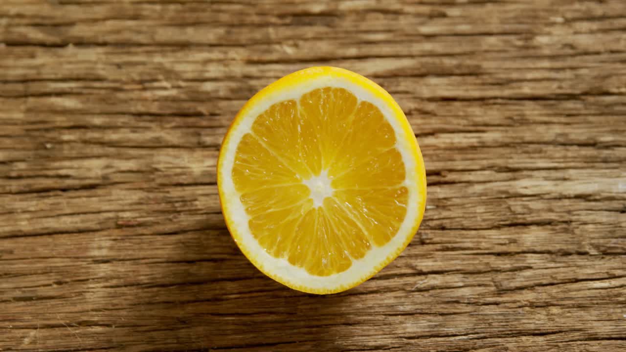 Halved lime on wooden table 4K 4k