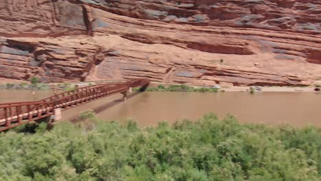 pan left over red bridge over colorado river in the united states in the canyon