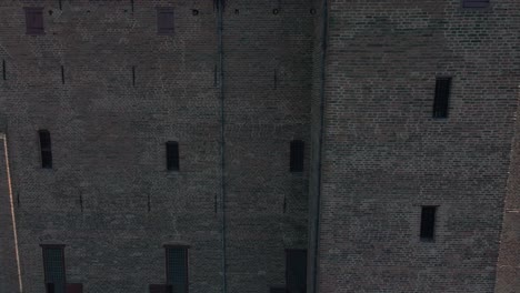 drone flying around structure and brick of unesco monumental building castle loevestein in the netherlands