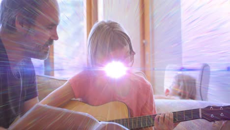 animation of light flashing over caucasian father learning daughter how to play guitar