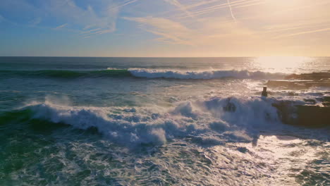 stormy ocean splashing sunny day slow motion. rough sea waves foaming at nature