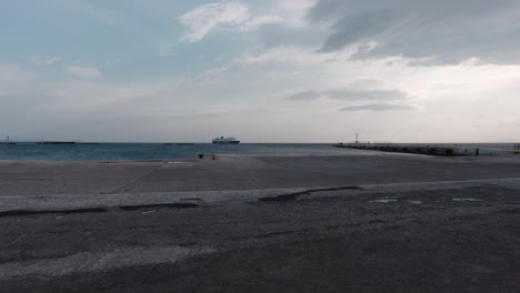 ship approaching tinos port on a windy day