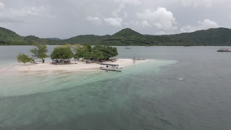 low aerial flyover, gili bedis sandy islet of coast of tropical lombok