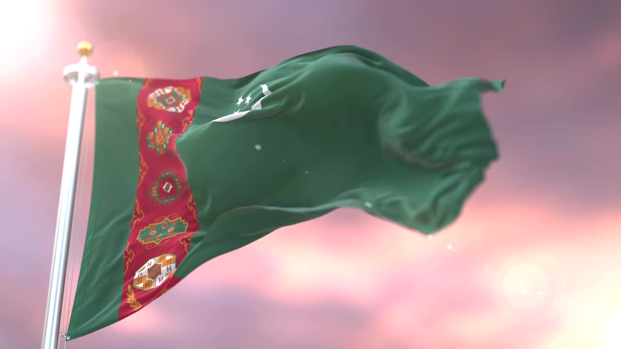 bandera de turkmenistán ondeando en el viento en lento al atardecer, bucle