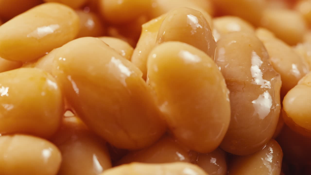 Canned red bans preserved beans rotating background close up side view. Organic steamed beans. Pickled bean for a Mexican dish