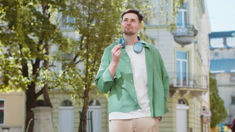 cheerful rich happy man showing wasting throwing money around hand gesture big profit win lottery