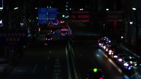 a night timelapse of the miniature traffic jam at the city street in tokyo