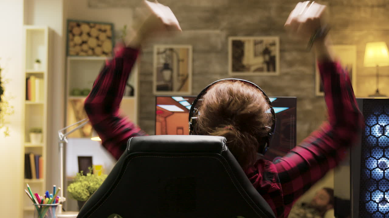 A gamer plays a video game on their computer