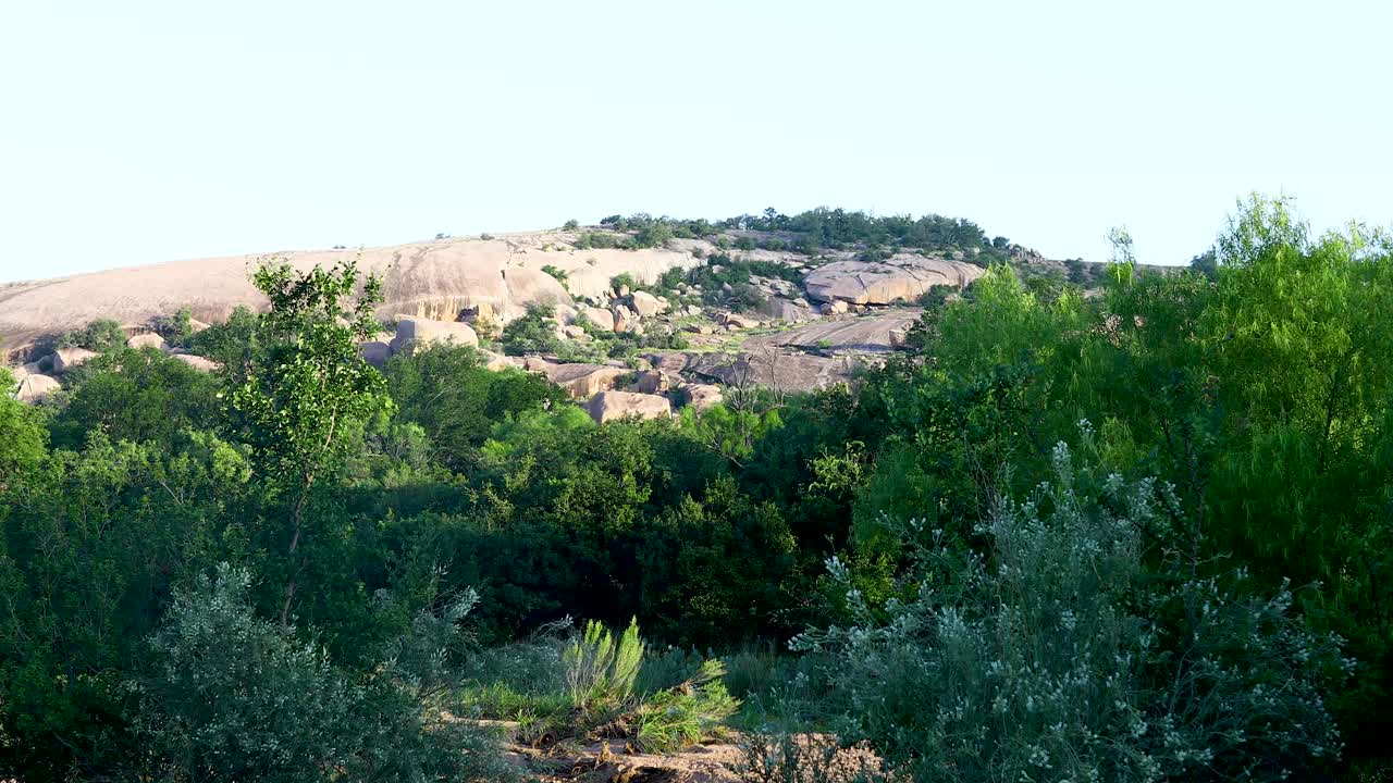 Static video of Enchanted Rock in Texas. This is a famous site in Texas near Fredericksburg. The largest solid piece of granite and has famous history with Native American tribes