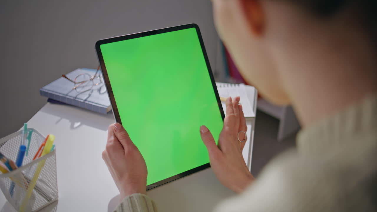 Chromakey tablet teacher swiping display browsing internet home office closeup