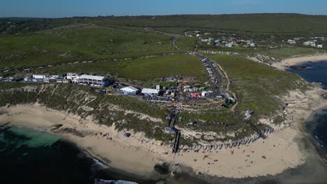 People-at-surf-league-competition-event-on-Margaret-River-region-beach,-Australia