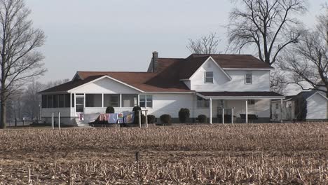 Clothes-Hang-Outside-To-Dry-Near-A-Large-Rural-Homestead