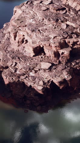 aerial view of a rocky cliff beside a river