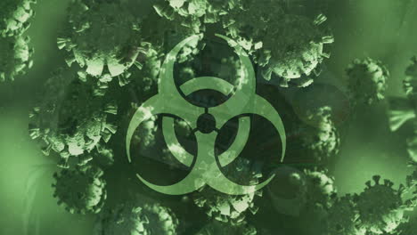 animación de un signo de peligro biológico y células de covid-19 flotando sobre un fondo verde