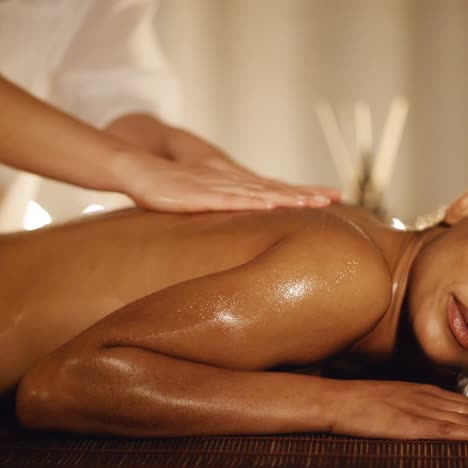 woman having therapy massage of back