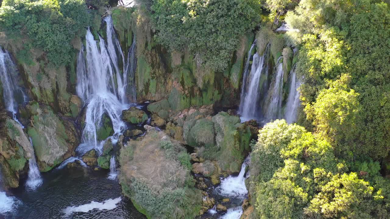 Kravica Waterfalls in Bosnia and Herzegovina on the Trebizat river, Aerial dolly out close up shot