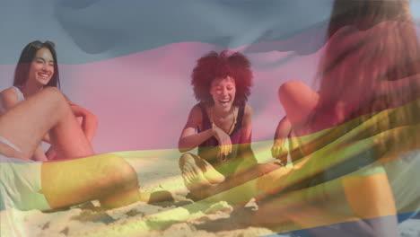 animación de la bandera alemana ondeando sobre diversos amigos sentados y disfrutando en la playa